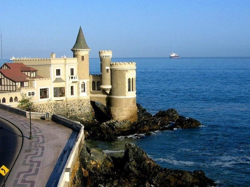 Castillo Wulff and its turret built out onto the rocks at the edge of the Pacific